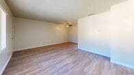 Located at 345 W 41st St in San Bernardino, CA, this single-story, one-bedroom, one-bathroom unit offers a practical and comfortable layout. Throughout the space, light-toned luxury vinyl plank flooring creates a clean, cohesive aesthetic that ties each room together.

The open combined living and dining area provides a generous, flexible space anchored by a ceiling fan and a textured ceiling. A wall-mounted heating unit ensures year-round comfort, and multiple closets along the hallway offer ample storage. The bedroom is comfortably sized, featuring a ceiling fan, a window-mounted air conditioning unit with outdoor views, and a full-width mirrored sliding closet that enhances the sense of space.

The galley-style kitchen is efficiently designed with cream-toned cabinetry, stone-patterned countertops, a double stainless steel sink, a gas range, and a full-size refrigerator. Vertical blinds on the kitchen window allow for adjustable natural light. The full bathroom includes a single-sink vanity with stone-patterned countertop, a toilet, and a tub/shower combination with white tile surround, complemented by a window for natural ventilation. The textured ceilings and neutral walls throughout lend the space a clean, move-in-ready appearance.