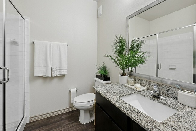 Modern bathroom with walk-in shower - Highline Apartments