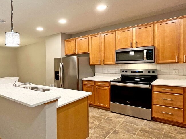 Building Photo - Upscale Townhome with Large Office-Loft, 3 Baths, 2-Car Attached Garage, Quartz Countertops and M...