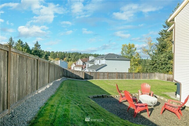 Backyard with firepit and room for boat/RV - 9781 Enchantment Ave NW