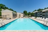 This 600 square foot apartment in Lakeside Park, Kentucky, offers efficient living in a modern setting. The single-floor layout comprises one bedroom, one bathroom, and an open-concept living area. The primary bedroom, measuring 160 square feet, provides ample space and features a large window for natural light. The living room is expansive, with neutral-toned walls and plush carpeting, creating a cozy atmosphere. A sliding glass door leads to an outdoor area, enhancing the sense of space.

The bathroom showcases a contemporary design with a white tub-shower combination and brushed nickel fixtures. The kitchen, while compact, is well-equipped with white cabinetry, granite countertops, and stainless steel appliances, including a full-size electric range. Throughout the apartment, the color palette of soft grays and whites contributes to a clean, fresh aesthetic. The textured ceiling adds character to the space, while multiple windows ensure brightness throughout. This apartment efficiently utilizes its square footage, offering a comfortable living space with modern amenities in a prime Kentucky location.