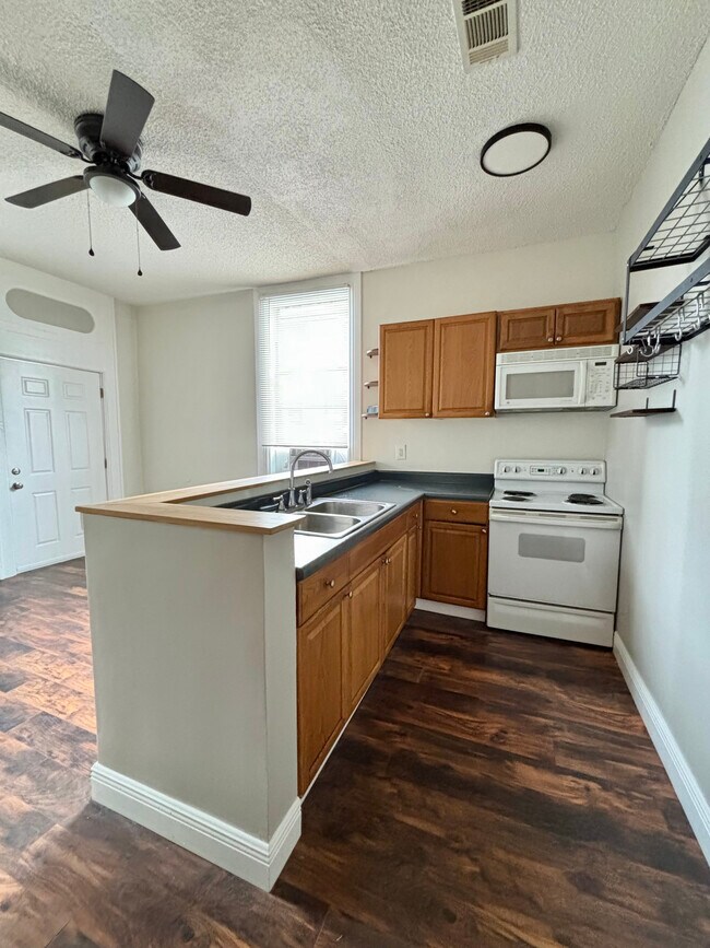 Newer appliances, space saving over range microwave/exhaust hood, built in storage to maximize space - 2423 St Ann St
