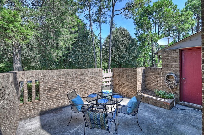 Patio, off of great room with lots of space for a table and area for gardening or flowers - 8001 Charter Oak Ln