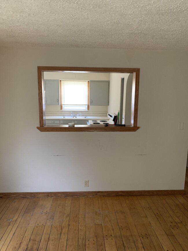 Living room into kitchen view - 404 E Mulberry St