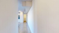 Located at 231 E 25th St in Little Rock, AR, this thoughtfully designed single-floor residence offers a modern aesthetic with a clean, open layout. Polished concrete floors run throughout the entire space, providing a sleek, industrial-chic foundation that reflects natural light beautifully.

The open-concept living, dining, and kitchen area forms the heart of the home. The kitchen is a standout feature, boasting light wood cabinetry, a striking vibrant green tile backsplash, stainless steel appliances including a French door refrigerator and range with overhead ventilation hood, and a central island with a quartz countertop. The living and dining areas are bright and airy, lined with large multi-pane windows that flood the space with natural light, while a ceiling fan adds comfort overhead. A bold yellow accent wall adds a dynamic pop of color to the living area.

The spacious primary bedroom offers generous proportions, with two closets providing ample storage. The full bathroom features a soaking tub and shower combination with large-format tile surround, a wood-toned vanity with matte black hardware, and polished concrete flooring. Additional practical spaces include a dedicated laundry room and utility room, completing this well-appointed and stylish residence.