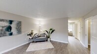Located at 1220 Meredith Dr in Columbia, SC, this two-story home offers four bedrooms and two bathrooms thoughtfully distributed across two floors. The main level features a welcoming living room with neutral-toned walls, light wood-look flooring, and a textured ceiling, creating a bright and comfortable gathering space. The kitchen is well-appointed with white cabinetry, light countertops, and a full suite of stainless steel appliances, including a dishwasher, range, microwave, and refrigerator. A dining nook adjacent to the kitchen benefits from a large window that lets in ample natural light and offers views of the surrounding greenery. Upstairs, the bedrooms feature plush carpeting, ceiling fans, and generous closet space — the primary bedroom includes a walk-in closet, while secondary bedrooms offer built-in shelf closets. Each bedroom is well-lit by windows with slatted blinds. The bathrooms are clean and functional, featuring full tub-shower combinations. Throughout the home, a consistent neutral color palette and practical finishes contribute to a cohesive, move-in-ready atmosphere. Two hallways connect the spaces across both levels, ensuring an efficient and accessible layout throughout.