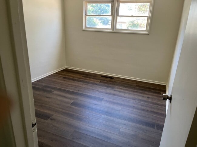 Building Photo - New flooring, New Paint. Garage & Carport