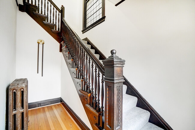 front stairway to Apartment - 312 E 3rd St