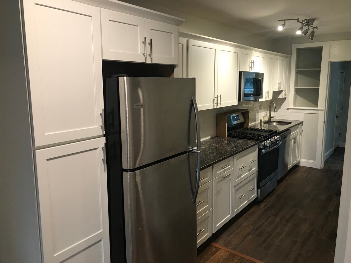 Galley kitchen with extended granite countert - 1612 17th Pl SE