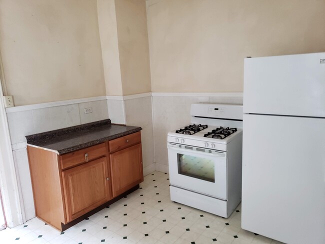 Spacious kitchen with included appliances. - 392 Marilla Street