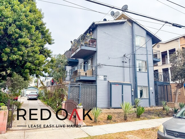 Building Photo - Charming One Bedroom with Sun-Drenched Roo...