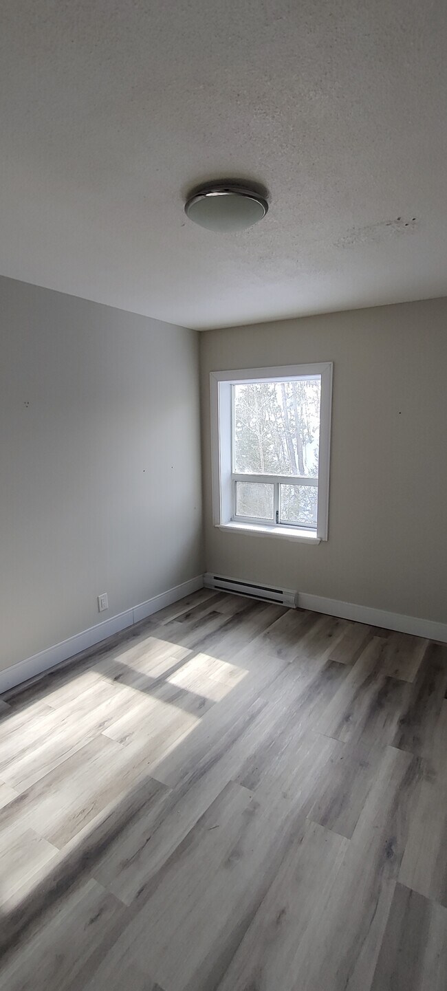 Photo du bâtiment - Spacious 3BR Apartment with Modern Finishes & Bright Open Layout