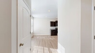 Located at 1061 Spring Creek Dr in Forest, VA, this two-story home offers a thoughtfully designed layout spread across two comfortable floors. The main level welcomes you into a bright, open living room featuring light hardwood-style flooring, a ceiling fan, and multiple windows that flood the space with natural light and views of the surrounding landscape. A front entry door with transom window adds an inviting touch. The kitchen and dining area flow seamlessly together, showcasing rich dark espresso cabinetry, granite countertops, stainless steel appliances including a range and built-in microwave, and recessed lighting — a functional yet stylish space for cooking and entertaining. The main floor also includes a dedicated laundry area. Upstairs, three bedrooms provide comfortable retreats, each with plush carpet flooring, ceiling fans, and windows offering natural light. The spacious primary bedroom includes a walk-in closet and private access to its own bathroom. All three bathrooms are finished with dark vanity cabinetry, white countertops, and neutral tile flooring, maintaining a consistent, clean aesthetic throughout. Ample closet storage — with six closets across the home — ensures practical living. The home's neutral color palette, modern finishes, and well-organized floor plan make it a versatile and move-in-ready residence.