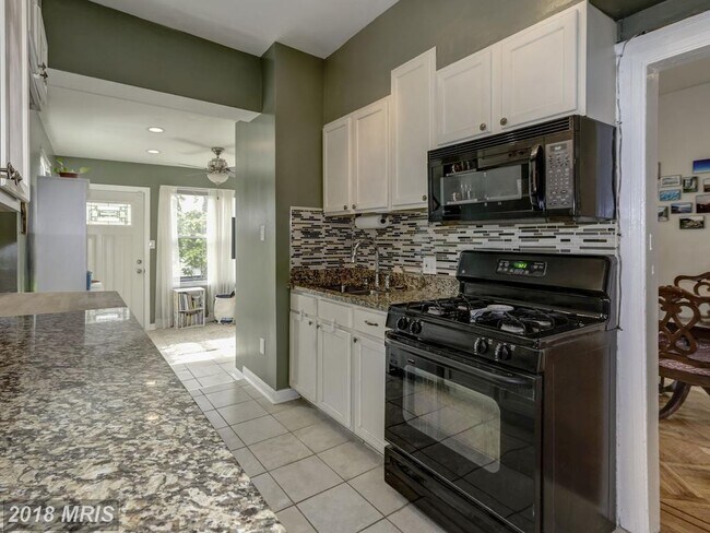 Kitchen. Sunroom off the back - 616 Lamont St NW