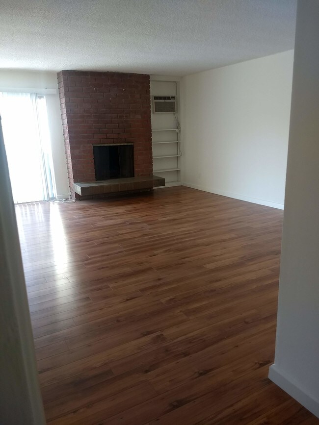 Living room w fireplace - 839 S Sherbourne Dr