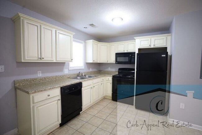 Building Photo - First month move in special $600!! Recently built 2 bed, 1 bath apartment - includes dishwasher a...