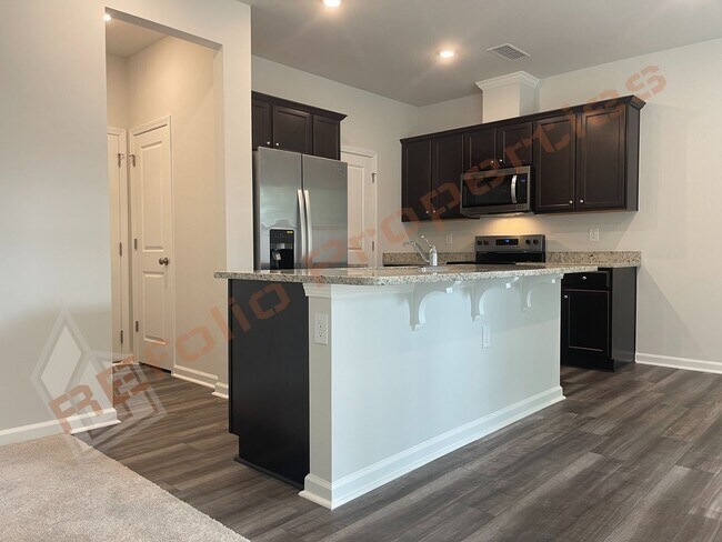 Building Photo - BRAND NEW Beautiful Townhouse Backed to Wo...