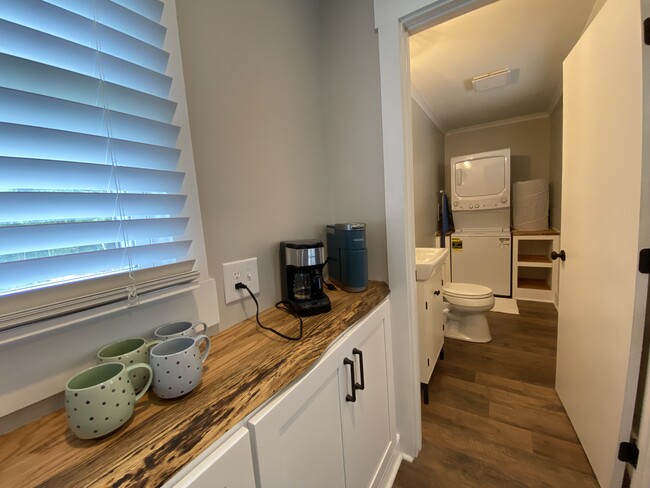 Half bath and laundry area. - 2115 Country Ct