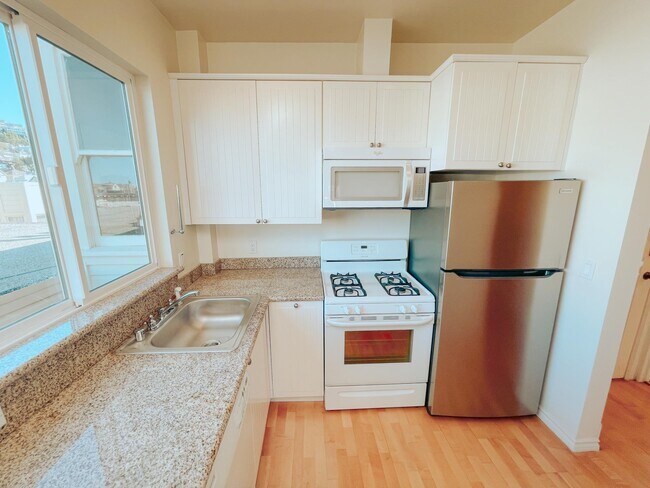 Kitchen with Dishwasher, Stainless Steel Fridge, Oven, and Microwave - 121 Carl St