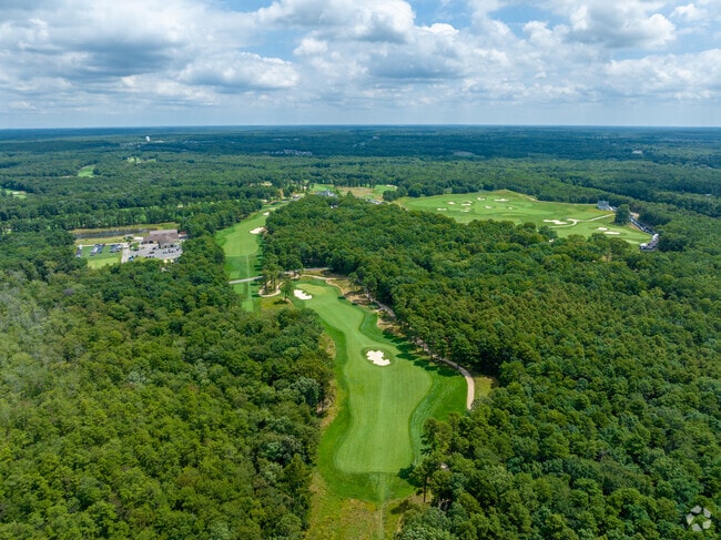 Golfers enjoy scenic fairways at Metedeconk National Golf Club in Jackson.