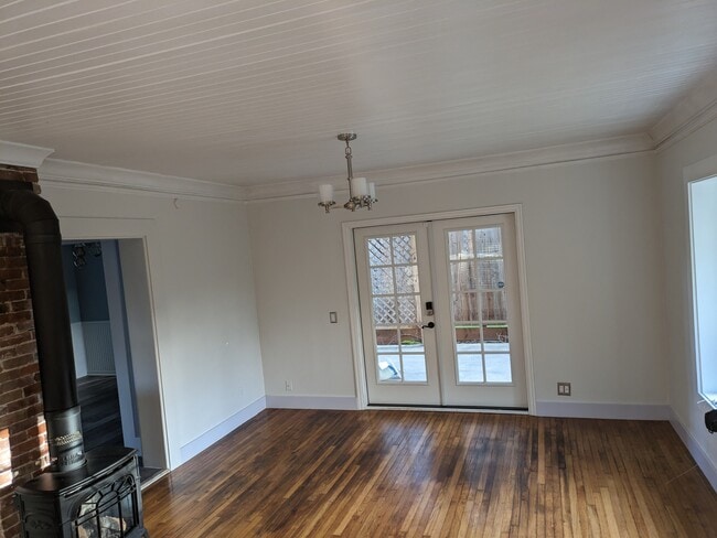 Living room with French doors to covered patio - 5420 NE 28th Ave