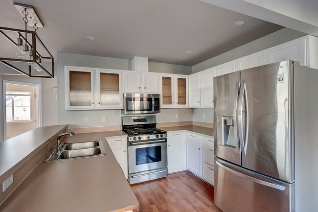 Building Photo - Spacious 4-Bedroom Home with Cozy Backyard...