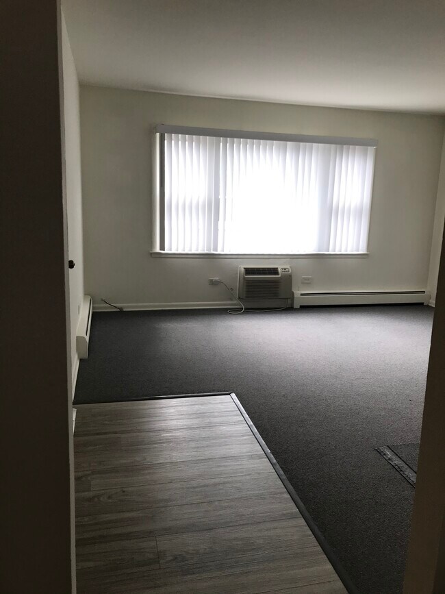 Living room with ample light and new blinds. - 8616 47th St