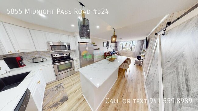 Foto del edificio - 5855 Midnight Pass Rd