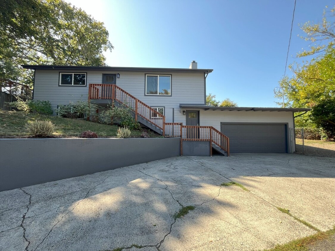 Primary Photo - Spacious 4-Bedroom, 2-Bathroom Home with D...