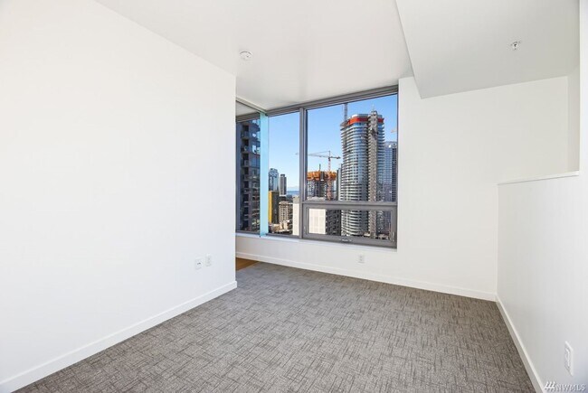 Building Photo - Spacious NW-Facing 1 Bed + Den, 1 Bath Luxury High-Rise Condo in Seattle's Denny Triangle – Nexus