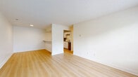 Located at 124 Coors Boulevard in Pataskala, Ohio, this single-floor, 2-bedroom, 1-bathroom residence offers a practical and well-organized layout with clean, neutral finishes throughout. The open-concept living, dining, and kitchen area serves as the heart of the home, with light wood-style flooring, textured ceilings, and a bright, airy atmosphere. The kitchen features white cabinetry, granite-style countertops, a stainless steel refrigerator, dishwasher, and a built-in breakfast bar that seamlessly connects to the living and dining area. Both bedrooms are carpeted and finished with warm neutral tones, offering a comfortable and quiet retreat. The primary bedroom is generously sized and includes a spacious walk-in closet outfitted with wire shelving, built-in baskets, and a central island unit for ample storage. The full bathroom includes a tub-shower combination with clean white surrounds and wood-style flooring. A dedicated in-unit laundry room with side-by-side washer and dryer hookups adds everyday convenience. Additional storage is provided through multiple closets and a utility room. The home's consistent use of light tones and durable flooring materials creates a cohesive and functional living environment.