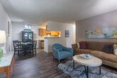 Located in San Jose, CA, this thoughtfully designed one-bedroom, one-bathroom residence offers a comfortable and functional single-floor layout. The open living and dining area is anchored by wood-look flooring, a textured ceiling, and a ceiling fan that adds a casual, airy feel. A sliding glass door in the living room floods the space with natural light and opens directly to a private outdoor patio. The dining area, separated from the living room by an open layout, accommodates a full dining set and is complemented by a ceiling fan with integrated lighting. The galley-style kitchen features light wood cabinetry, light-toned countertops, a built-in sink, a dishwasher, and stainless steel appliances including a refrigerator and range. A pass-through connects the kitchen to the dining area, enhancing the open flow. A dedicated laundry area with a stacked washer and dryer provides added convenience. The bedroom offers carpeted flooring, a bright window with natural light, and a wide sliding-door closet for ample storage. The bathroom includes a generous vanity with dual sinks, light wood cabinetry, and wood-look tile flooring, offering both style and practicality throughout.