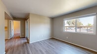 Located at 5800 Hamilton St in Sacramento, CA, this single-level residence offers 2 bedrooms and 3 bathrooms within a well-organized, functional floor plan. The interior is finished with light-toned laminate flooring throughout, complemented by neutral beige and warm gray walls that create a clean, cohesive aesthetic.

The living room is bright and open, featuring a large window that frames outdoor greenery and fills the space with natural light. Adjacent to it, the combined dining and kitchen area is practical and well-appointed, offering white cabinetry, light countertops, a dishwasher, electric range, and ample upper and lower cabinet storage — ideal for everyday use.

Both bedrooms are comfortably sized and include sliding closet doors, providing convenient storage. The primary bedroom is notably spacious and benefits from a window with outdoor views. A total of three closets throughout the unit offer generous storage capacity.

The three bathrooms are finished consistently, each featuring white vanities with under-sink cabinetry, mirrored medicine cabinets, and tub-shower combinations. The textured ceilings and clean trim work throughout maintain a tidy, well-maintained appearance.

A private patio rounds out the layout, offering outdoor space for relaxation. Two hallways connect the rooms efficiently, supporting smooth flow across the entire single-floor layout.
