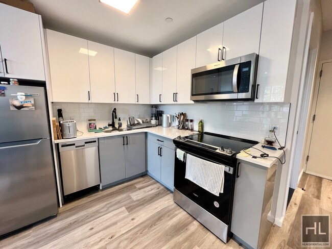 Building Photo - New Construction! Modern 1.5 Bedroom in th...