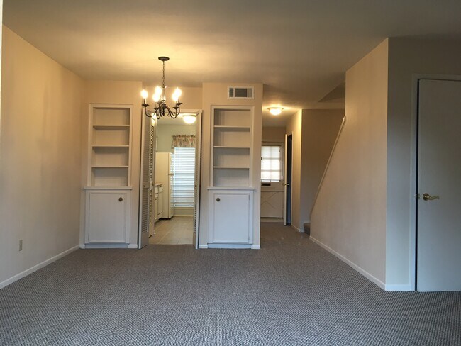 Living room facing kitchen Front entry - 7946 Leonora St