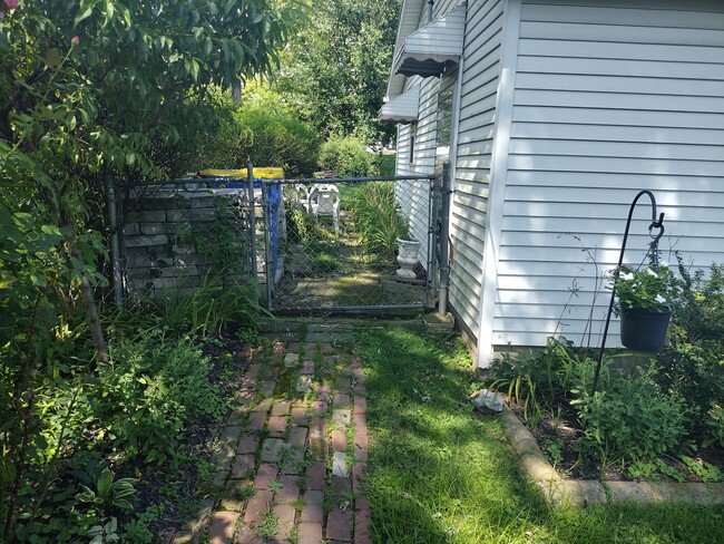 Walkway to two car garage and trash bin/recycling area - 211 S 19th St