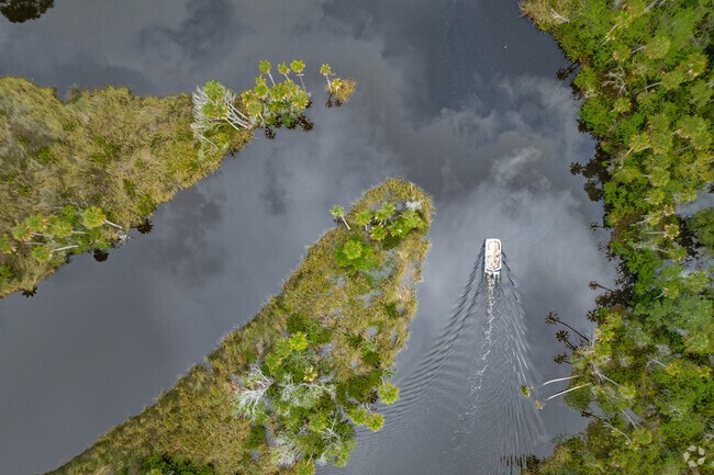 Glassy water flows along the Cotee River in New Port Richey.