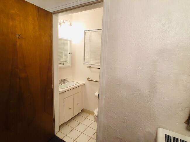 Half bath off of the front bedroom - 7120 McClure Ave