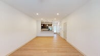 Located at 3262 S Railroad St in Phenix City, Alabama, this two-story home offers a thoughtfully designed layout spread across two floors. The main level features an open-concept living area with light wood-tone flooring, recessed lighting, and clean white walls that create a bright, welcoming atmosphere. The kitchen is a standout feature, boasting rich dark-wood cabinetry, granite-style countertops, stainless steel appliances including a French door refrigerator, range, and built-in microwave, plus a breakfast bar peninsula that connects seamlessly to the living space. A convenient bathroom is also located on the main floor. Upstairs, the primary bedroom is generously sized, featuring plush carpet flooring, a ceiling fan, and its own dedicated closet and en-suite bathroom. The second bedroom is equally comfortable, also finished with carpet and a ceiling fan, with natural light filtering through blinds. The bathrooms are well-appointed, offering dark-wood vanities with stone-look countertops and tiled tub-shower combinations with brushed nickel fixtures. A hallway and additional closet space complete the upper level, providing practical storage throughout. The home combines modern aesthetics with functional design for comfortable everyday living.