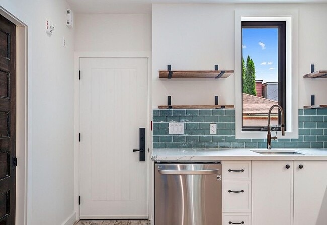 Kitchen and front door - 95 Leslie St