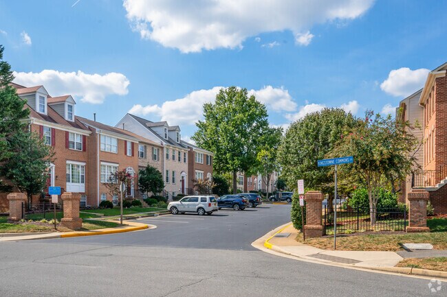 A picturesque row of charming brick homes lines the streets of Kingstowne Commons Dr.