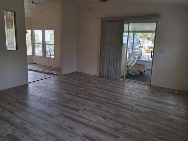 Living room and screened porch - 35303 SW 180th Ave