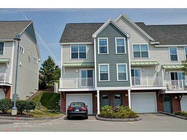 Front of townhouse. On right of car. - 14 Heron Cove Dr
