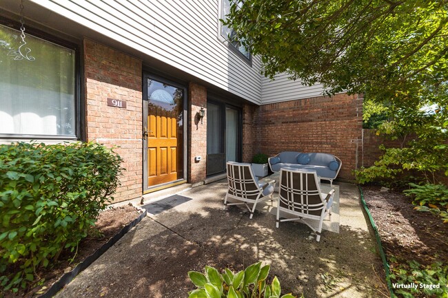 Front entrance & courtyard - virtually staged - 911 Outlook Ridge Ln