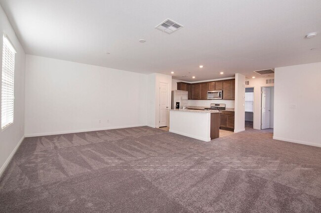 Building Photo - Newer Townhome - 3 Bedrooms + 2 Car Garage - E Craig & Nellis