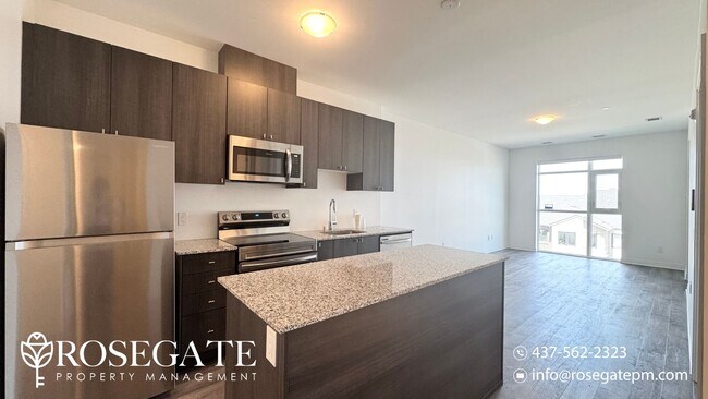 Photo du bâtiment - Modern 1+Den Condo in Milton – 695 Sq Ft w...