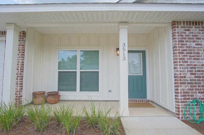 Building Photo - 3 bed 2 bath brick townhome with a 2 car g...