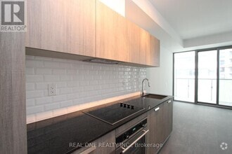 Building Photo - 50A-1050 Charles St E