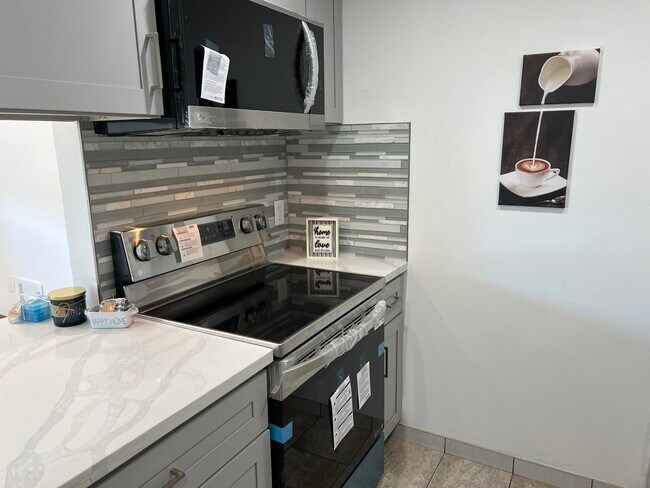 New Range. Brand new cabinets. - 1119 Reed Ave