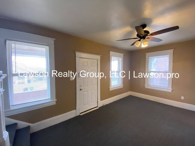 Building Photo - Updated Three Bedroom with Flat Yard
